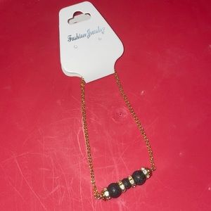 Unasex  bracelet gold and black design